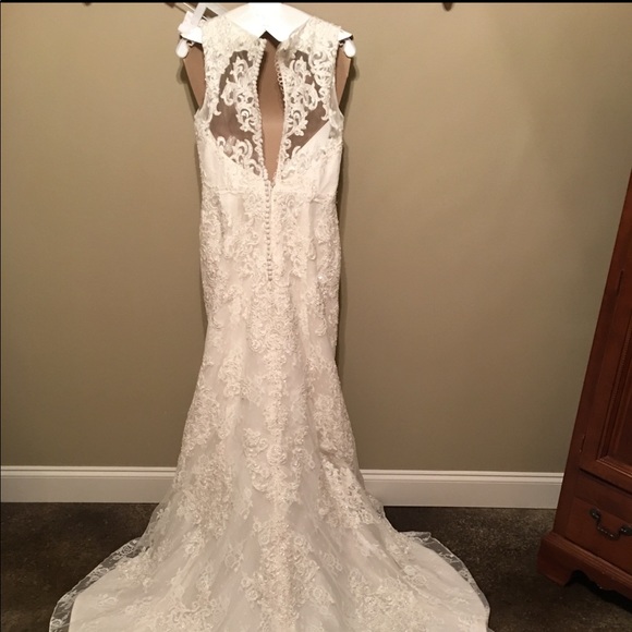 Wedding dress from David’s bridal Never worn. Size 8. Paid $1400 asking $600 - Picture 2 of 5